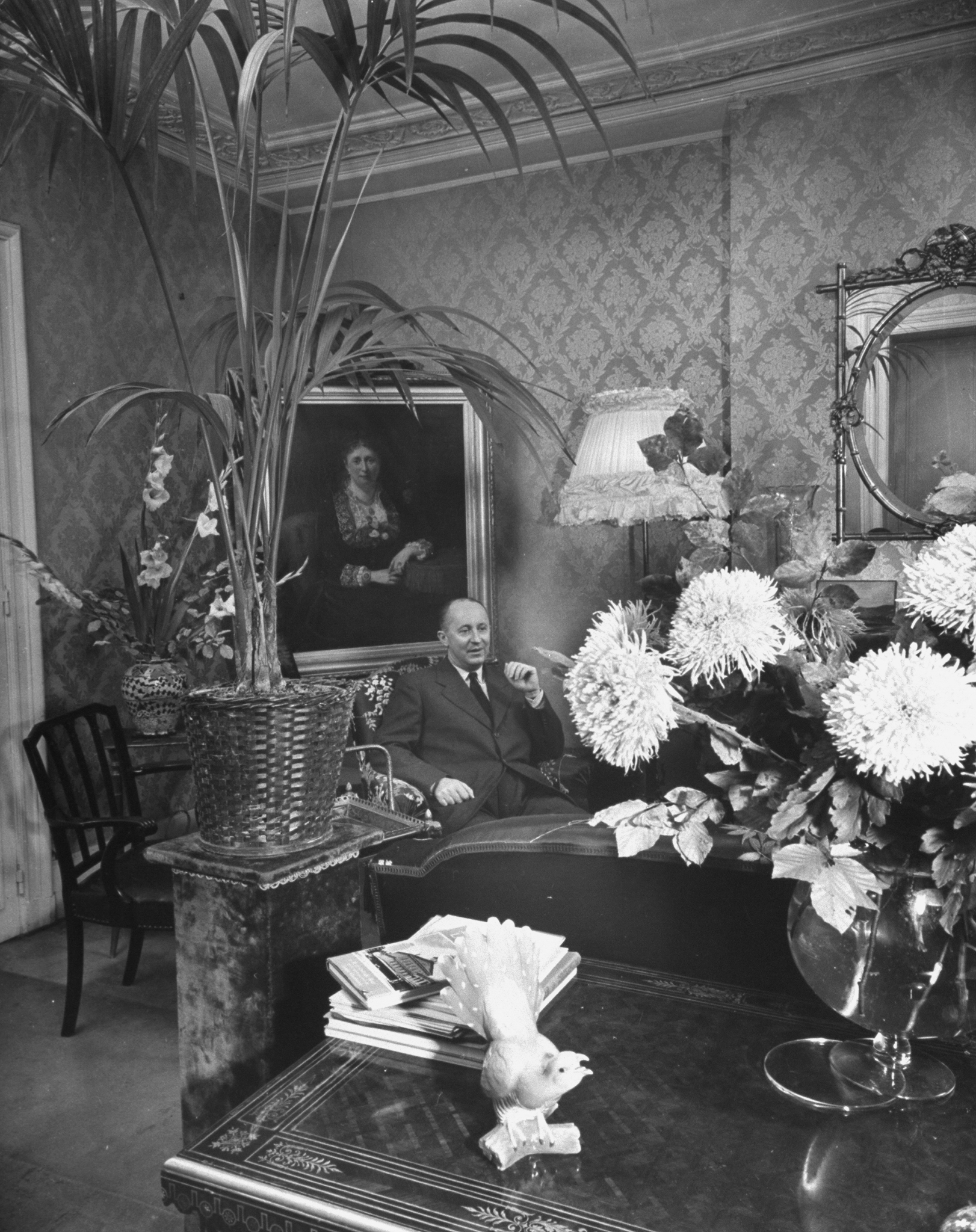 Christian Dior,Dress designer Christian Dior at home in his living room.  (Photo by Frank Scherschel/The LIFE