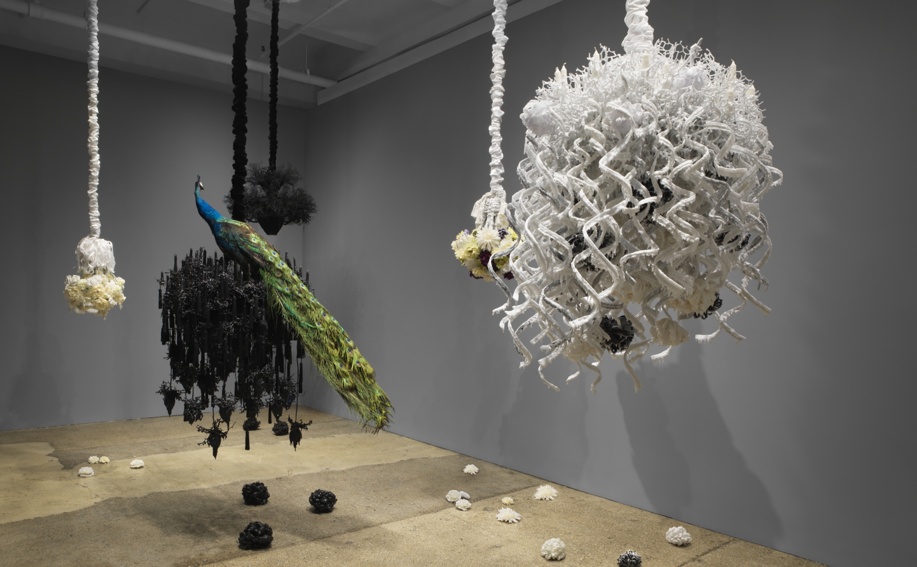 Petah Coyne Untitled #1410 (Mishima’s Spring Snow), 2015-16 Specially-formulated wax, pigment, ribbons, candles, chicken-wire fencing, wire, cable, cable nuts, thimbles, glue, steel, quick-link shackles, jaw-to-jaw swivel, silk Duchesse satin, 3/8″ Grade 30 proof coil chain, Velcro, thread, paper towels, plastic 66.5 x 46.5 x 46.5 inches (168.91 x 118.11 x 118.11 cm)