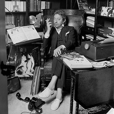 French singer-songwriter and poet Serge Gainsbourg at home in his study. (Photo by Christian SIMONPIETRI/Sygma via Getty Images)